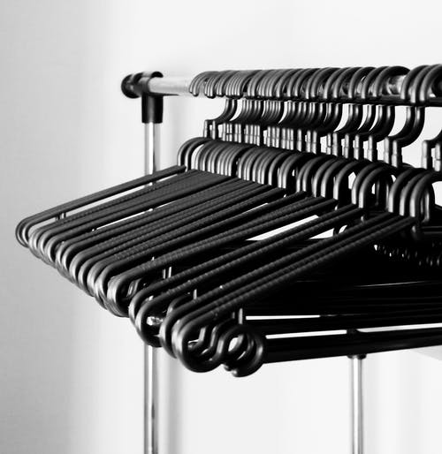 hard black hanger used in fluff n fold operations for regular shirts