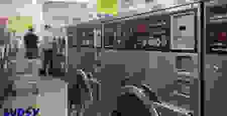 A detailed view of commercial washing machines with coin slots and control panels, illustrating the need for accurate coin handling in high-traffic laundry operations.